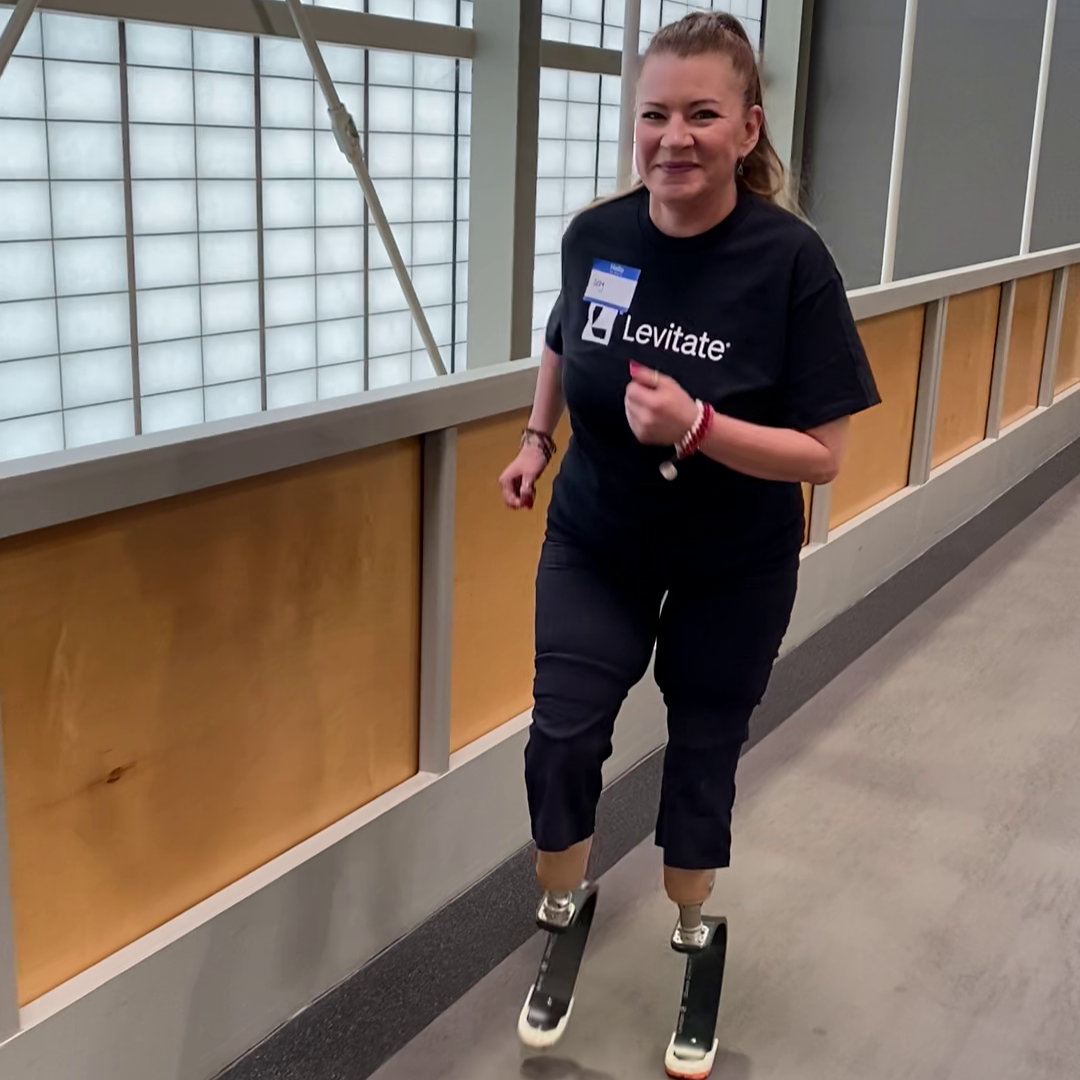 Abigail Wold, a 43 year-old woman, learns to walk on two prosthetic legs.