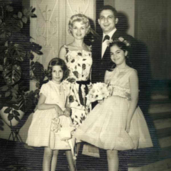 A black and white photo of a family from the 1960s, with young Emmi and Marcie in front.