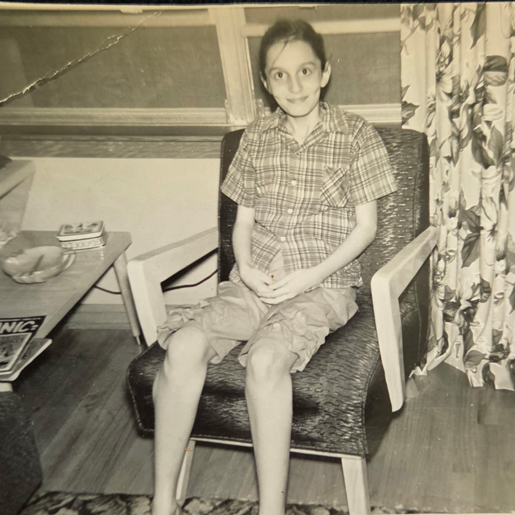 Marlene Moulder at age 10, a few weeks after leaving the hospital, sitting in an armchair
